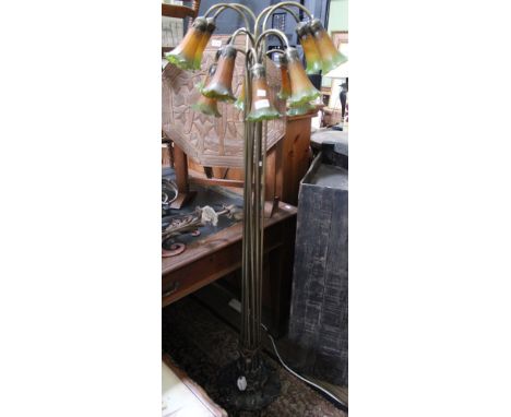 A twelve stemmed floor standing Tiffany style lamp (a/f) Condition: one of the glass shades is cracked and has a piece missin