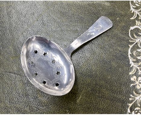 A George III silver caddy spoon, Birmingham hallmark, letter F, pierced stars and eight leaf pattern, circa 1778.