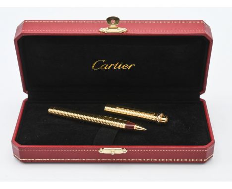 Rare must de cartier vintage (c1980's) trinity vendome oval 18k gold plated rollerball pen. The body and cap are 18kt gold pl
