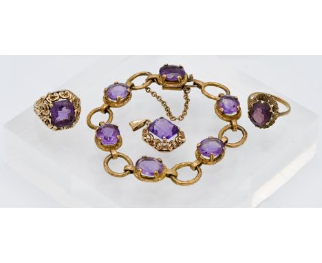 A 9ct gold and amethyst stone set bracelet, a 9ct gold amethyst ring and similar pendant, total weight 33.4g and another unma