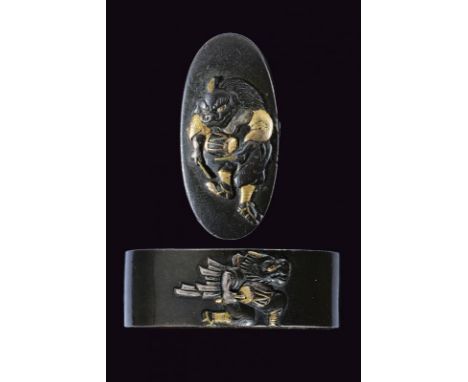 dating: Period (1603-1867) provenance: Japan, Of shibuichi with silver and gold details representing a shishi, koma inu, play