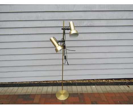 A brassed standard lamp with twin adjustable spots 