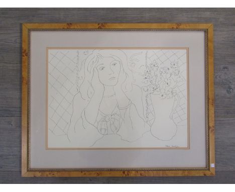 A framed and glazed print after Henri Matisse, lady with jug of flowers.  Signed in the print bottom right.  35.5cm x 50.5cm