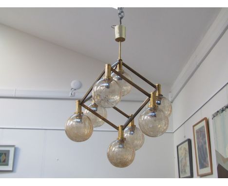 A brass ceiling light with eight crackle glass ball shades 
