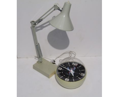 A Newgate "bubble" clock together with an anglepoise lamp 
