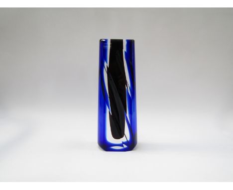 A Czech heavy glass stem vase, deep red well encased with clear and overlay blue, diagonal cut sides signed to base indistinc