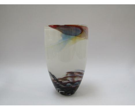 ANTHONY STERN (b.1944):  A studio glass vase, white with coloured flashes, encased in clear, signed to base, 26.5cm high 