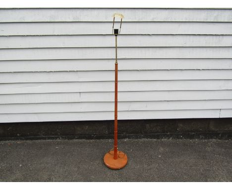 A Danish teak standard lamp with ring detail 