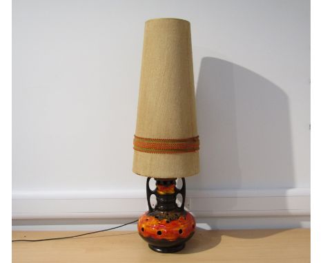 A West German pottery floor lamp with orange lava glaze over brown original shade.  125cm high overall