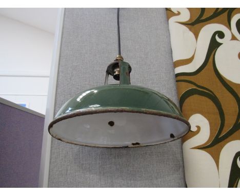 Two green enamel pendant lights, 27.5cm and 23.5cm diameters