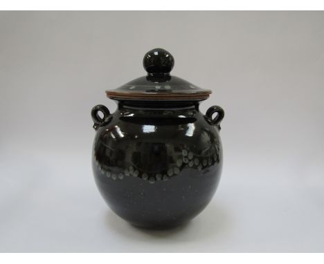 DAVID LLOYD JONES (1928-1994): A studio pottery large lidded canister with twin lug handles, tenmoku glaze with white dot det
