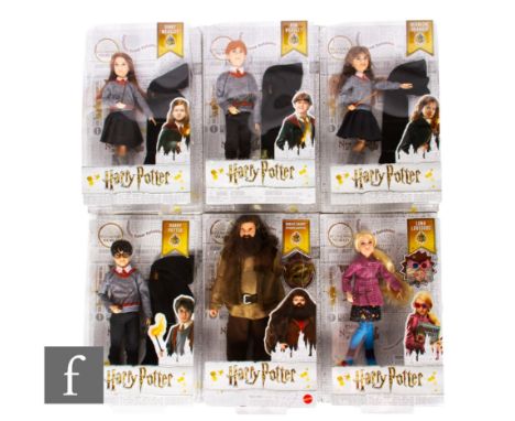 Six Mattel Harry Potter dolls, comprising Luna Lovegood, Rubeus Hagrid, Harry Potter, Hermione Granger, Ginny Weasley and Ron