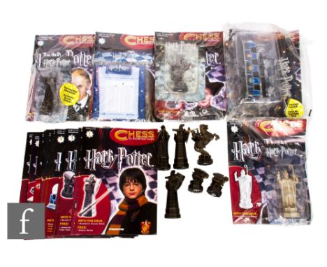 A DeAgostini Harry Potter Chess set, a collection of partwork magazines and related pieces.&nbsp;  PLEASE VIEW CONDITION REPO
