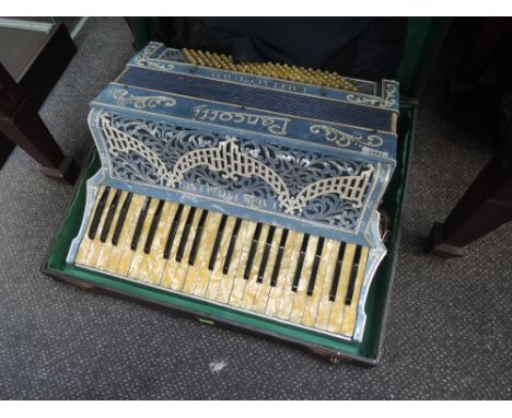 A Pancotti accordion , in fitted case