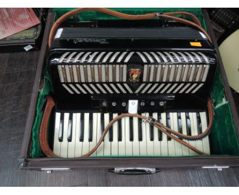 A Parrot Accordion , with case