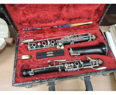 A cased clarinet, stamped Selmer 