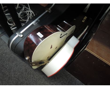 Two vintage plastic guitars