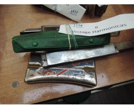 Six vintage harmonicas