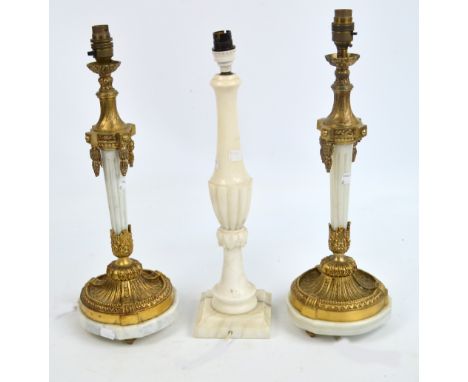 A pair of modern gilt metal mounted alabaster table lamps, height 43cm, and a further alabaster table lamp (3). CONDITION REP