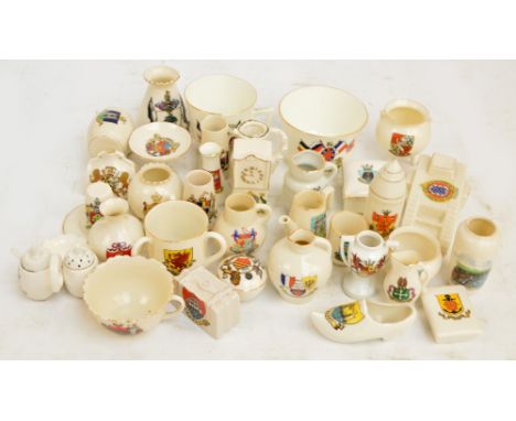 A quantity of crested china including an Arcadian tank, Goss etc (34). CONDITION REPORT: Scuffs and wear throughout the lot. 