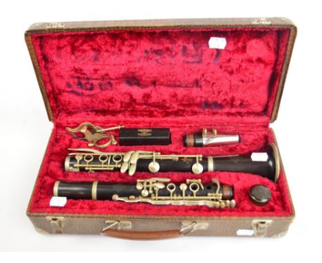 A cased clarinet stamped "G. Le Blanc, Paris" with four reeds. CONDITION REPORT: No splits or cracks, just some minor surface