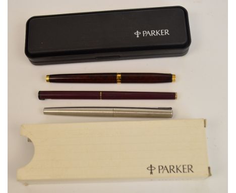 A cased Parker rolled gold fountain pen and pencil set with engine turned decoration, two further Parker fountain pens and an
