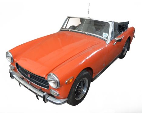 A 1973 MG Midget convertible; HKA 187L, 1275CC, orange. Chassis no. GAN5-132337G, engine no. 272. A much cherished and well m