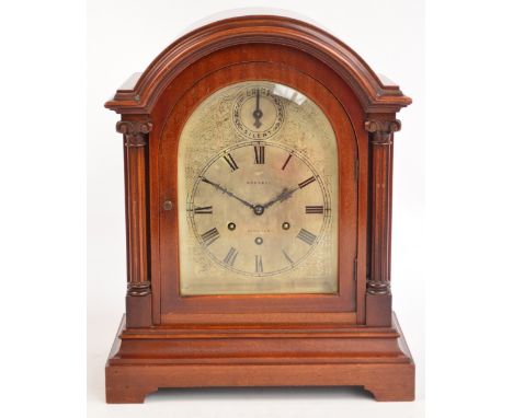 An Edwardian mahogany cased domed mantel clock with silvered dial set with Roman numerals and inscribed "Mansel Lincoln" bene