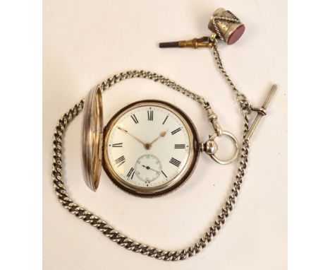 A Victorian hallmarked silver cased key wind full hunter pocket watch, the white enamel face with Roman numerals and subsidia