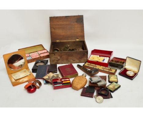 A quantity of varied collectors' items including a box of sconces, handles, and escutcheons, boxed games and counters, a crib