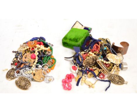 A small quantity of costume jewellery including a copper hammer decorated cuff bangle, various beads, stainless Omega watch o