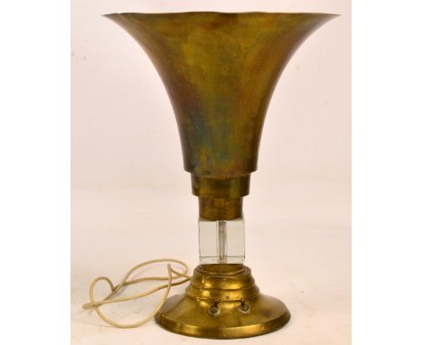 A mid 20th century perspex and brass table lamp, the inverted trumpet shade above square central block and spreading circular