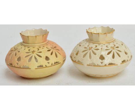 A pair of Locke & Co Worcester part reticulated squat circular vases with fluted rims, one blush ivory, one white, with gilt 