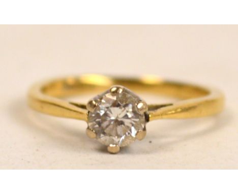 An 18ct yellow gold diamonds solitaire ring, the stone approx 0.2cts, on plain band with pierced shoulders, size I.