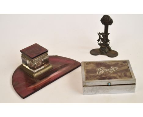 A vintage glass and chrome ink stand with glass square section inkwell and pen recess, a plated rectangular card box inscribe