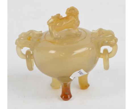 A c.1900 Chinese agate tripod censer and cover, the finial carved as a lion and with carved lion mask and loose ring handles,