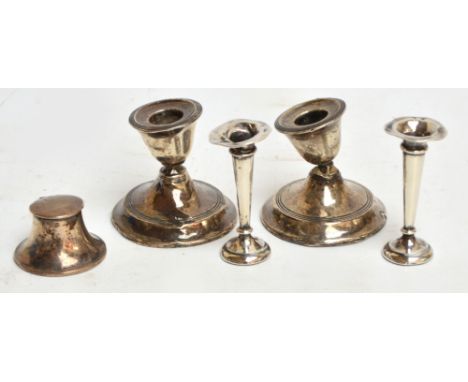 A small Edward VII hallmarked silver loaded capstan inkwell, probably T.H. Hazlewood, Birmingham 1907, diameter 5.5cm, a pair