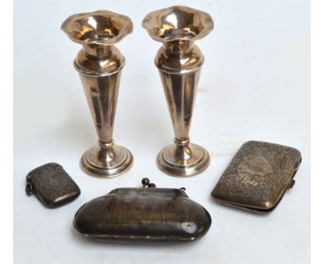 A pair of George V hallmarked silver bud vases with flared wavy rim and tapering body to a spreading circular loaded base, Va