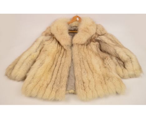 A vintage ladies silk lined Arctic fox fur coat, size 10/12. CONDITION REPORT: In a good condition.