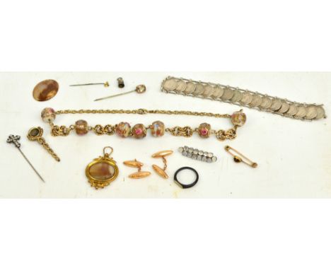 ***AMENDED DESCRIPTION*** A mixed lot of jewellery including a pair of 15ct gold torpedo cufflinks, a horn ring, a coin brace