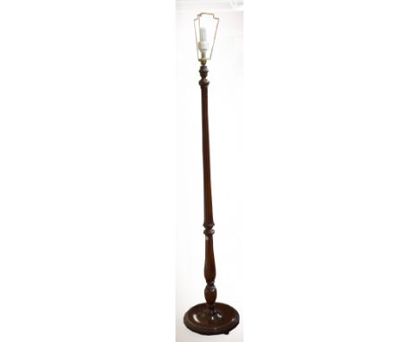 A mahogany standard lamp.