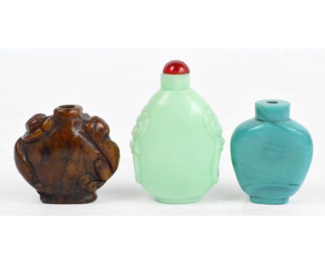 A turquoise coloured ovoid snuff bottle, height 6cm, a hardstone ovoid snuff bottle carved with two Chilong dragons to the sh