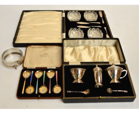 A cased set of six George VI hallmarked silver gilt and guilloche enamel spoons in different colours, Walker & Hall, Birmingh