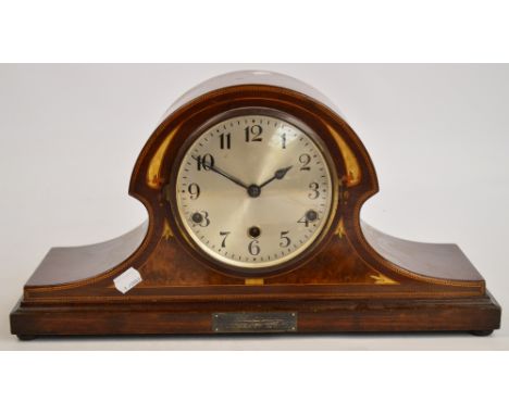 An early 20th century mahogany and inlaid mantel clock, the circular dial set with Arabic numerals, the eight day movement st
