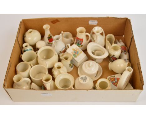 A quantity of Goss, Arcandian, Florentine, etc, crested wares to include The Bolton Trotter, The Whitby Ammonite, The Hunstan