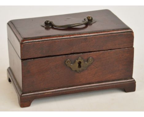 A small Georgian mahogany tea caddy of rectangular form raised on four bracket feet, the hinged lid enclosing three sections,
