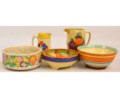 A Clarice Cliff "Gay Day" jug of octagonal baluster form, height 18cm, a similarly decorated jug of tapering form, a circular