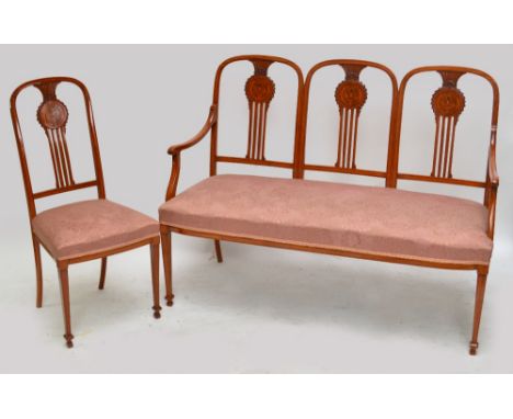 An Edwardian satinwood and inlaid five piece salon suite comprising triple arch back settee and four side chairs, each with c