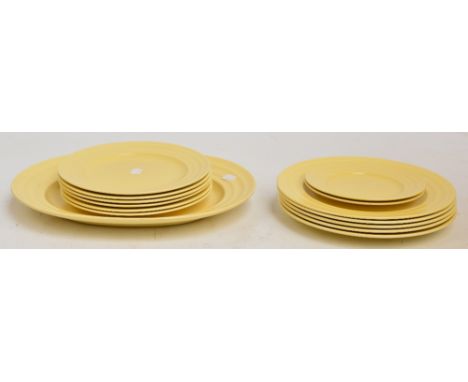 KEITH MURRAY FOR WEDGWOOD; An Art Deco "Mattstraw" dinner service comprising five dinner plates, six side plates, two smaller