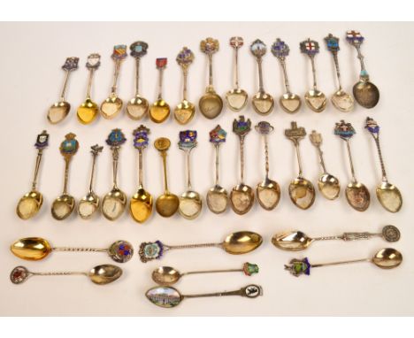 A large collection of predominantly hallmarked silver souvenir spoons, most with enamel decorated finials, weighable silver a